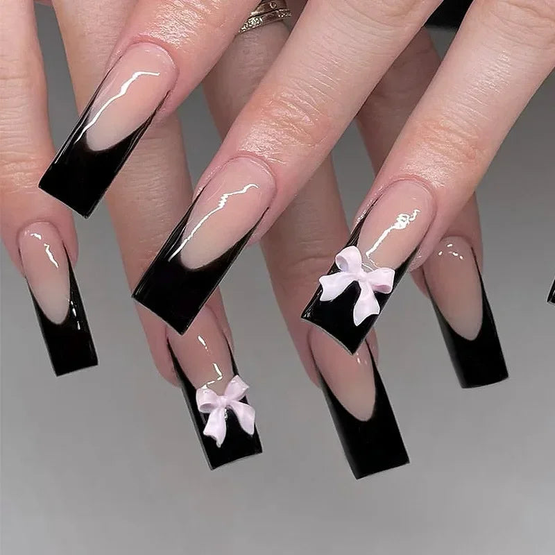 24pcs long coffin French press-on nails in black, featuring elegant bow and diamond details. Chic ballerina-style acrylic nails for a glamorous manicure in minutes.