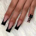 24pcs long coffin French press-on nails in black, featuring elegant bow and diamond details. Chic ballerina-style acrylic nails for a glamorous manicure in minutes.