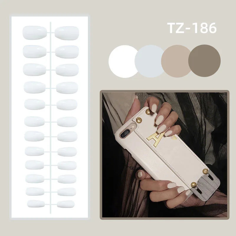 24pcs long coffin French press-on nails in black, featuring elegant bow and diamond details. Chic ballerina-style acrylic nails for a glamorous manicure in minutes.