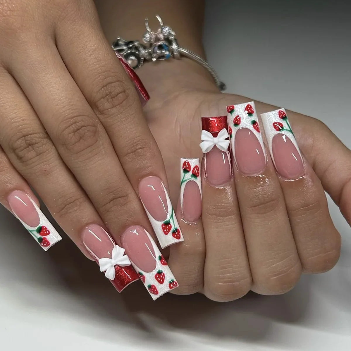 24pcs long coffin French press-on nails in black, featuring elegant bow and diamond details. Chic ballerina-style acrylic nails for a glamorous manicure in minutes.